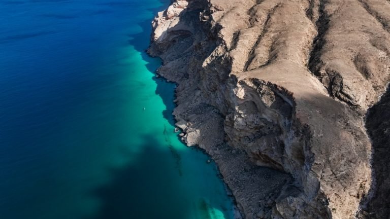 Stunning view of Shoab bay in Socotra showcasing clear blue waters and rugged cliffs